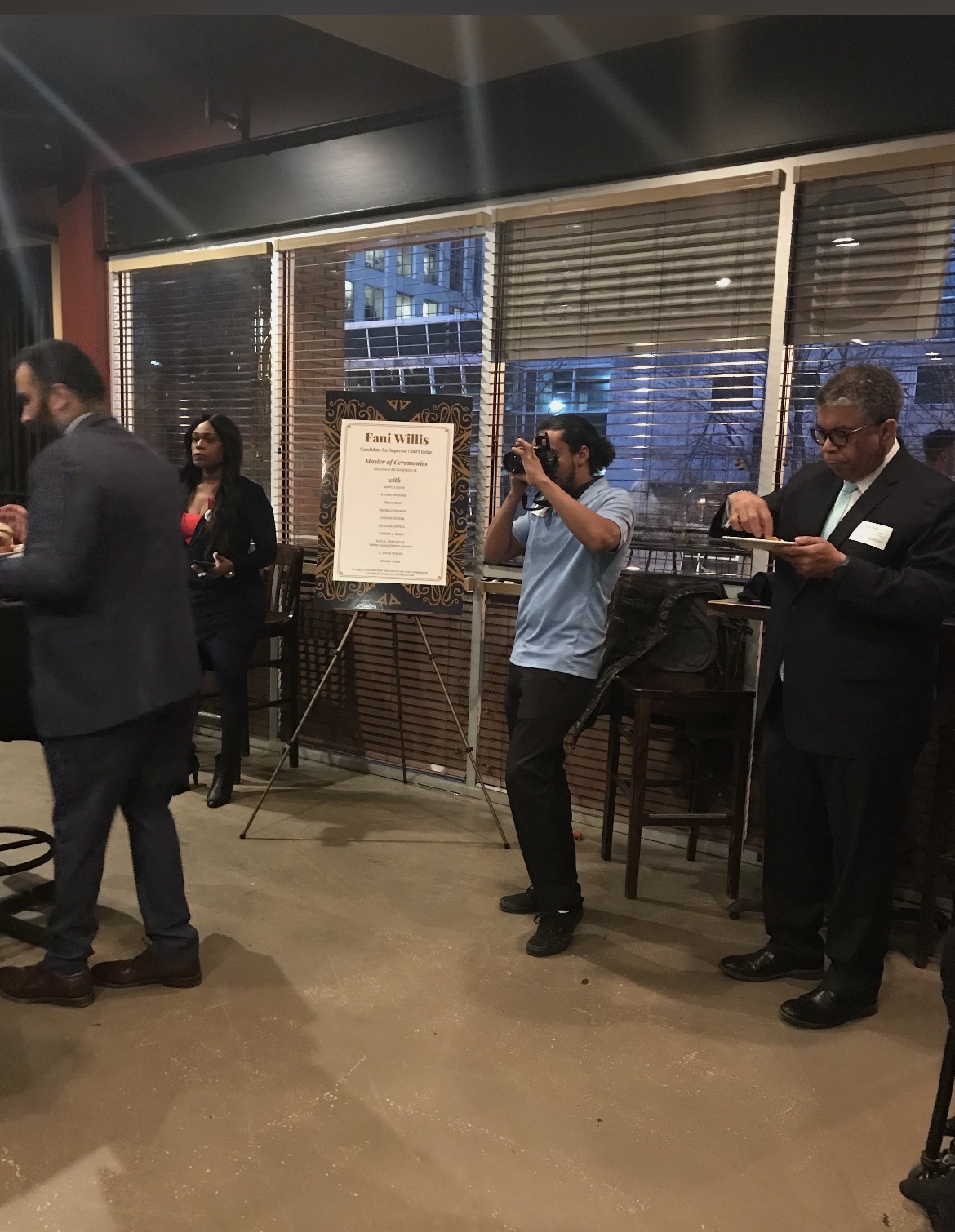 Shane Thaxton photographing the 2018 campaign event for Fani Willis